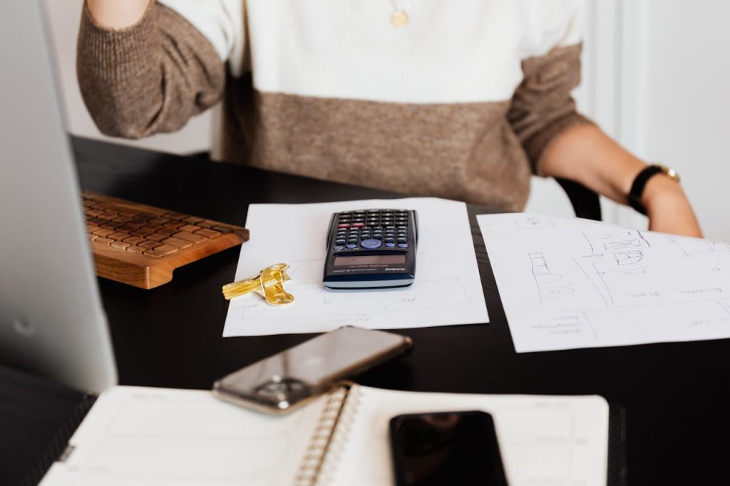 Mastering the First Impression: Your intriguing post title goes here A business desk setup with a calculator, papers, and a keyboard, reflecting a work environment.